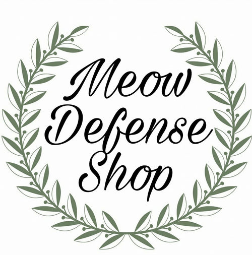 green laurel with words "Meow Defense Shop" in the middle